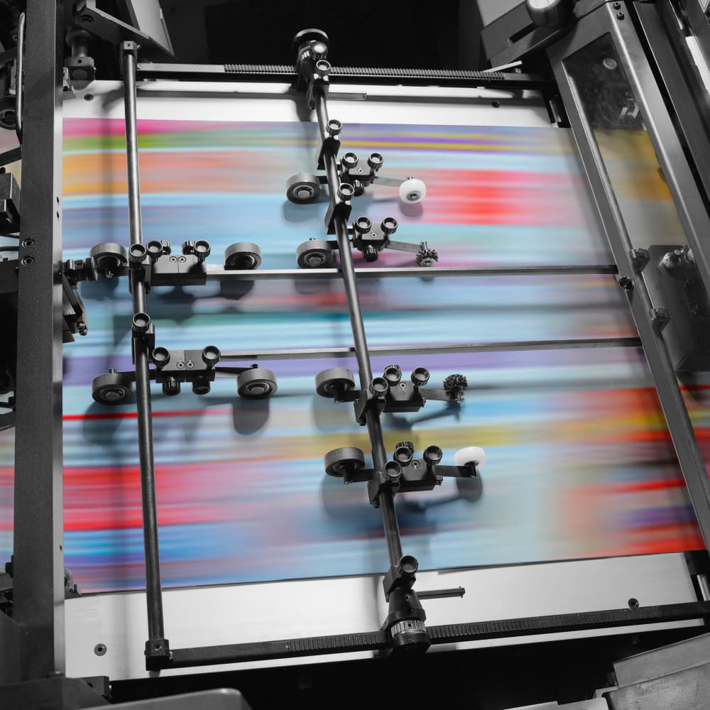 Sheets moving through a printing press